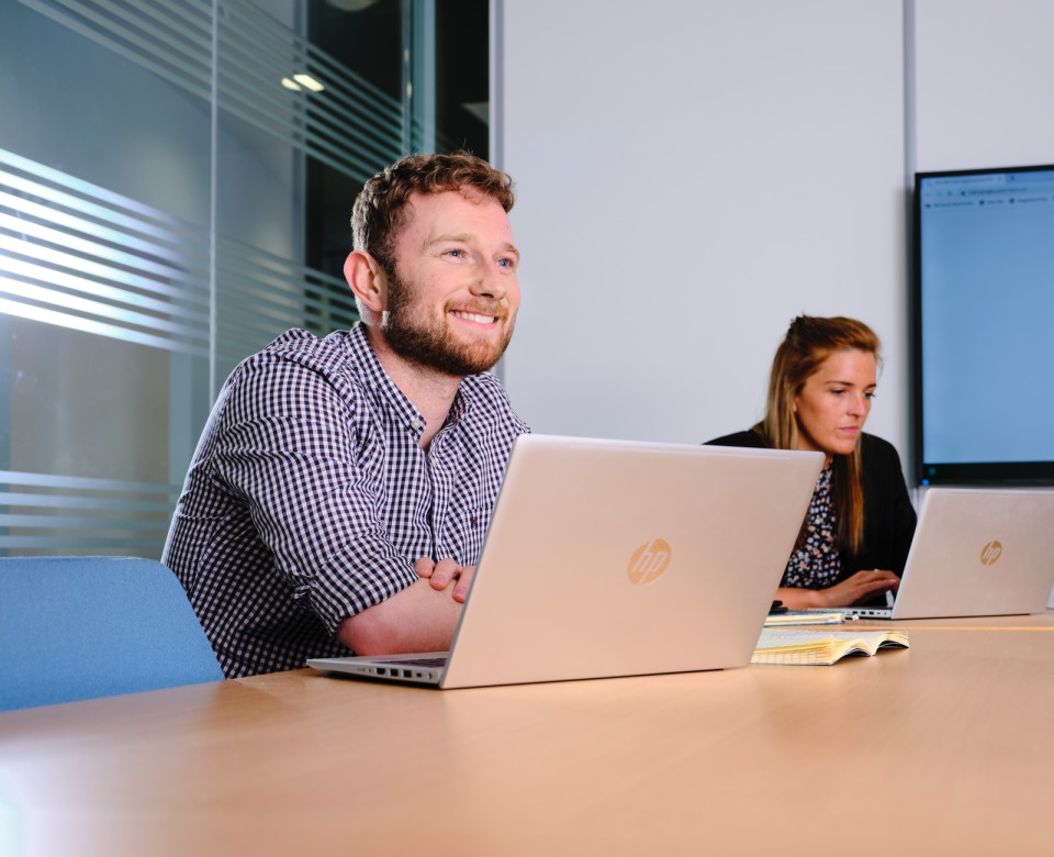 Colleagues working on laptops