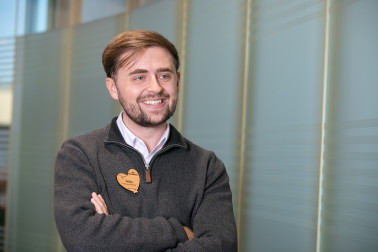 Male colleague smiling in office