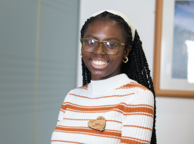 Smiling female colleague in office